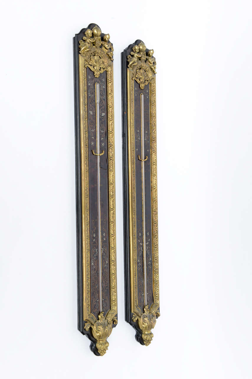 Exquisite Pair of fine Antique Gilt Bronze Mounted Tortoiseshell Inlaid Ebonized Boulle Marquetry Instruments by Gervais-Maximilien-Eugene Durand. Originals featuring exquisite bronze mounts with cherubs, brass and silver inlays. Fine instruments.