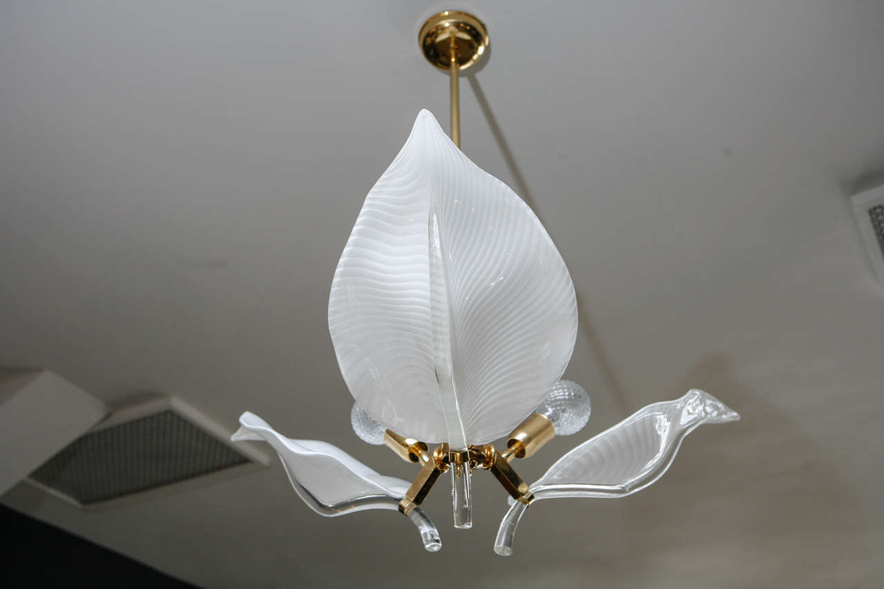 Murano glass 3 leaf chandelier in the style of Seguso Murano. Hand-blown, stylized leaves with brass fixture.