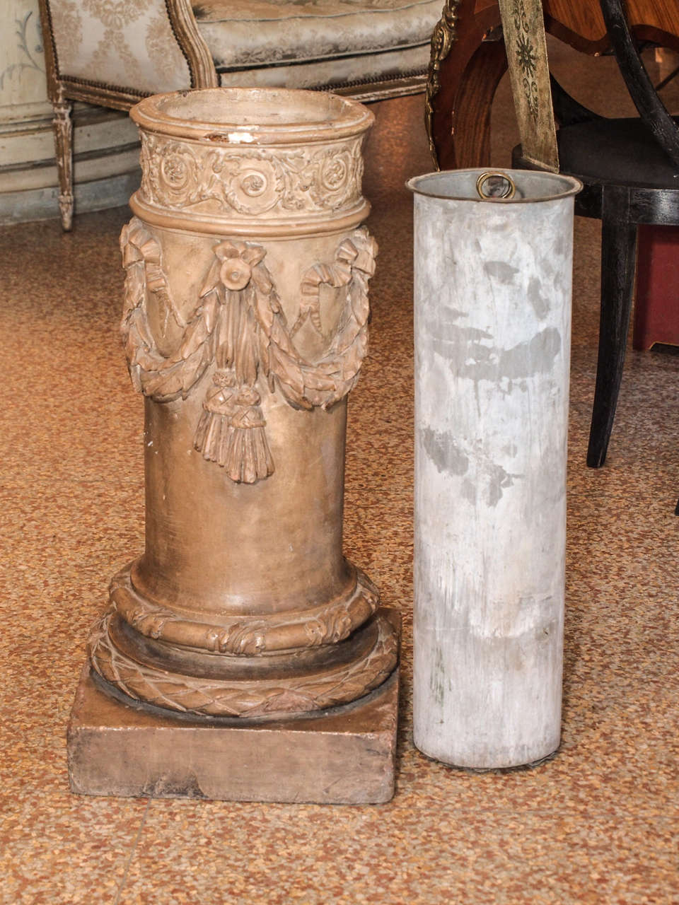 19th Century circa 1885-1895 terra cotta painted  pedestal with a zinc liner. The column is  ornamented with swags and tassels  and sits on a square base. The  inside liner is 6