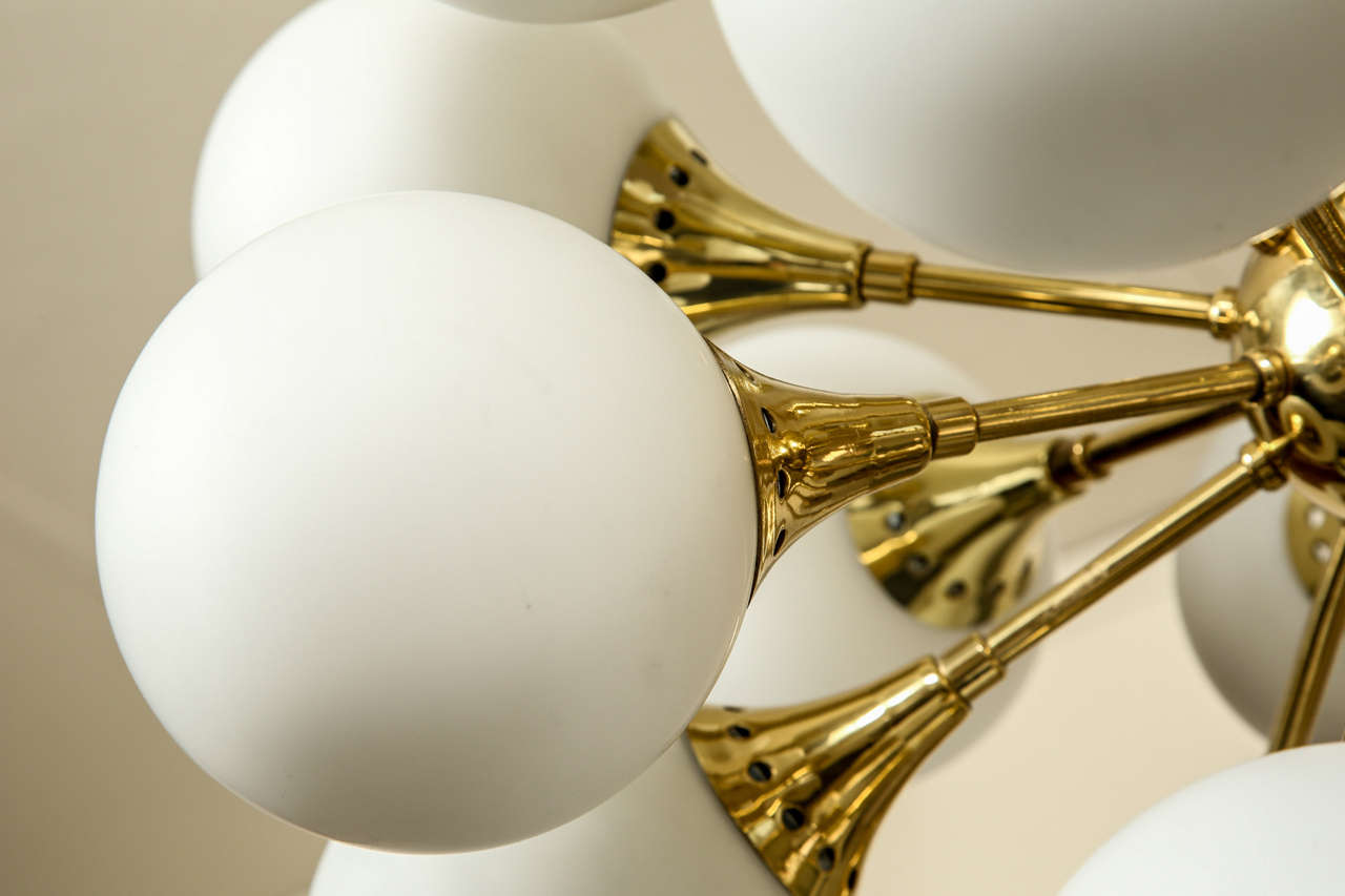 Fabulous brass sputnik chandelier with frosted glass globes. 1