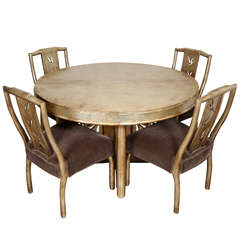 Round diining table with four chairs with pierced bamboo motif by James Mont