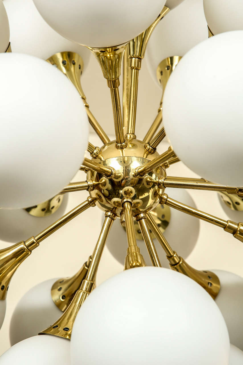 Fabulous brass sputnik chandelier with frosted glass globes. at 1stDibs