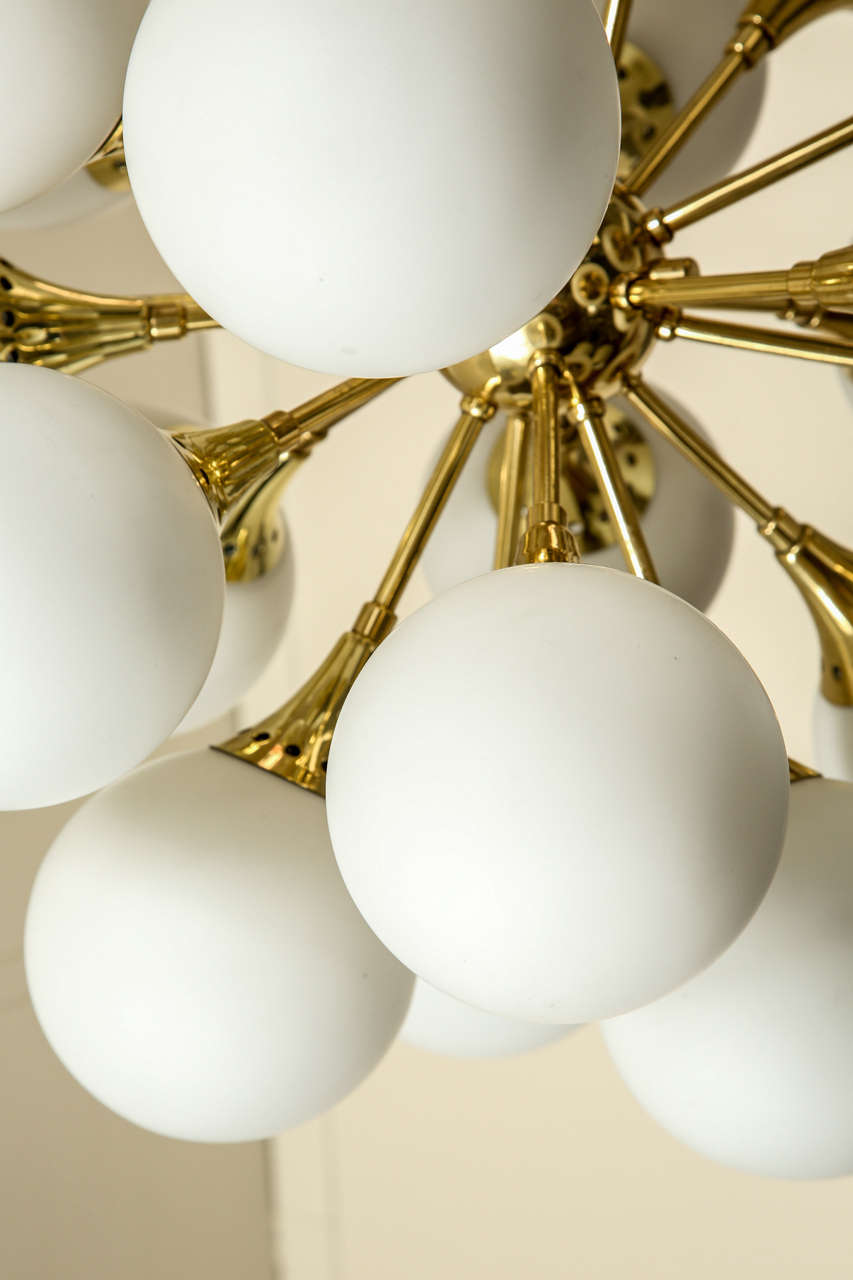 Fabulous brass sputnik chandelier with frosted glass globes. at 1stDibs