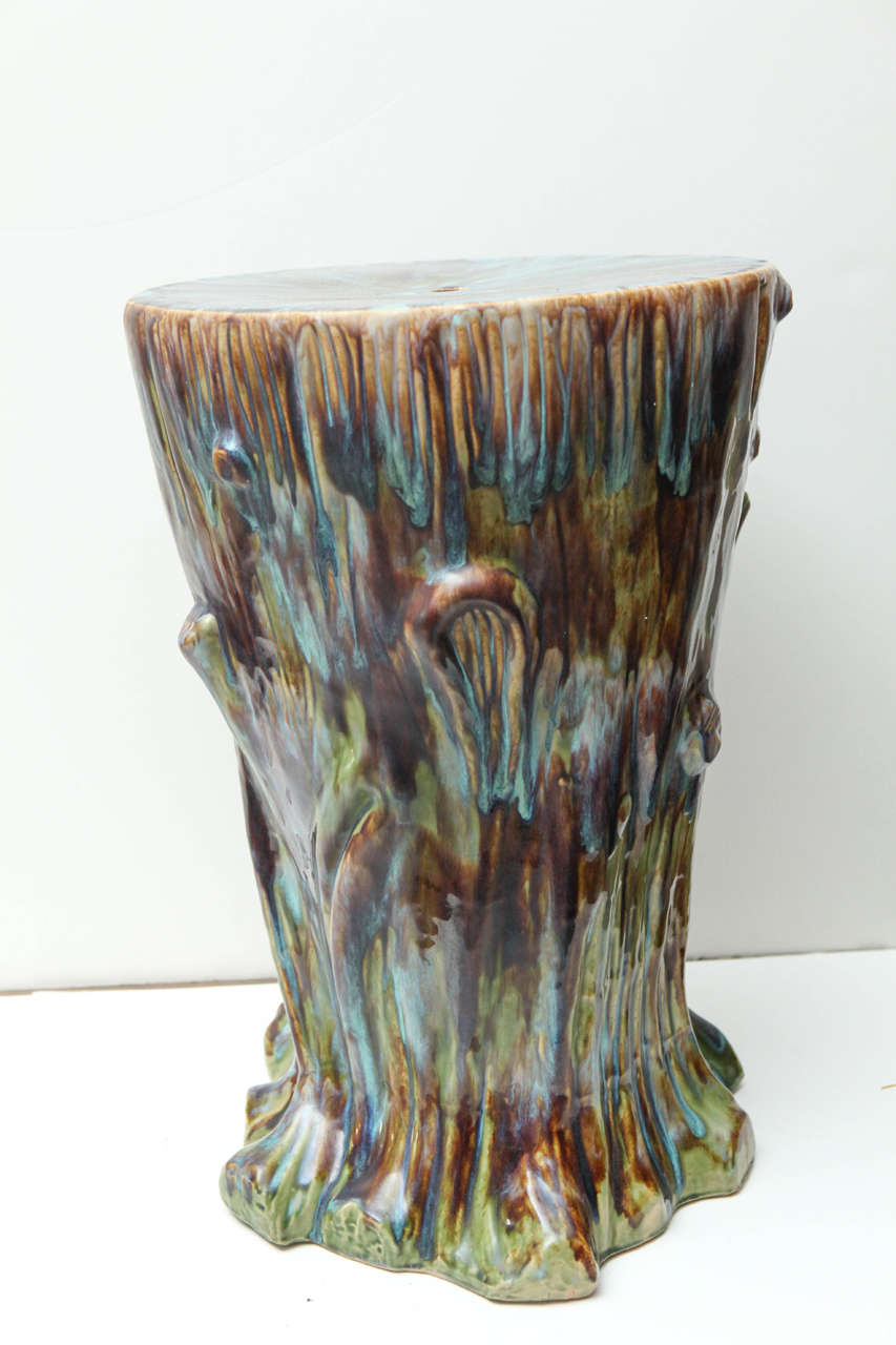 Organically shaped and multicolored ceramic garden stool.