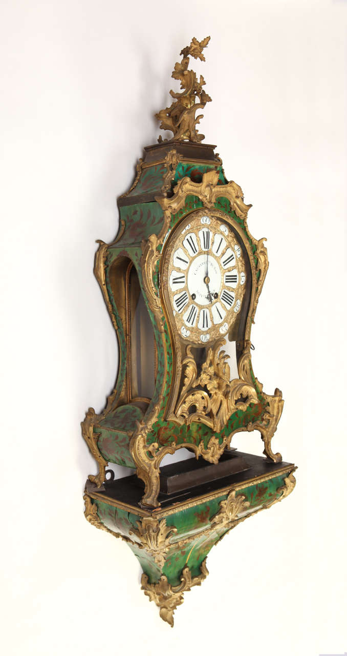 An early Louis XV green stained horn and gilt bronze-mounted bracket clock,
the clock second quarter of 18th century, the dial inscribed 'Causard Her du Roy a la Cour,' the case stamped 'Marchand'
124cm. high overall including bracket, 51cm wide