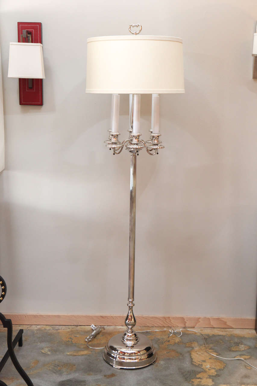 Modern, Georgian style polish nickel candelabra floor lamp completely restored. New polish nickel finish over metal. New linen shade. New electrical. Substantial weight.
b