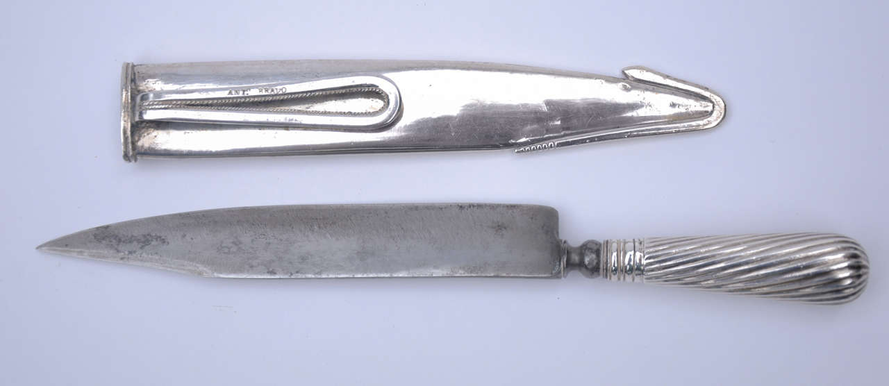 Solid Silver Gaucho Boot Knife with Steel blade, Silver Scabbard with a Rattlesnake Design. Signed Antonio Bravo. Argentina, Circa 1880.