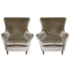 A pair of 1940s Italian arm chairs upholstered in velvet