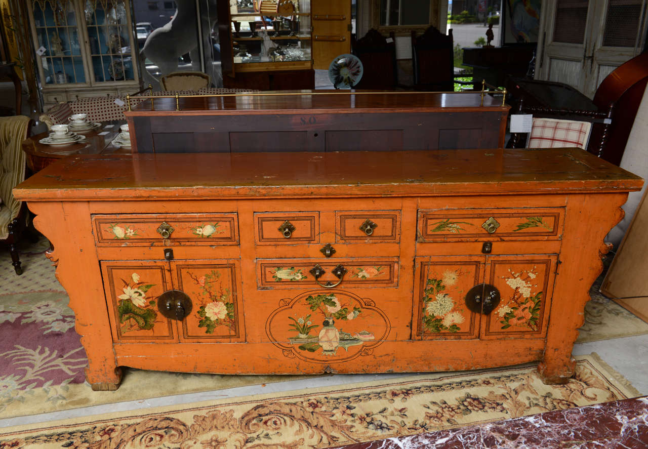 This is a superb large server all original from Asia with some age wear marks and dents on top. To The front there are some hand painted flowers, it has all the original handles and hinges
The drawers all run fine..