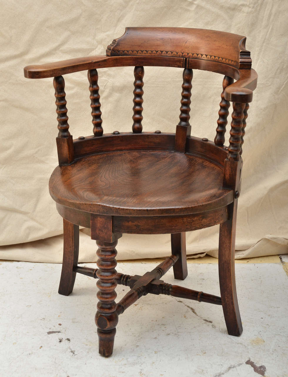 English Victorian Smokers Bow Arm Chair With A  Shaped Ash Circular Seat With Bobbin Turned Spindles At Back. A Bobbin Turned Front Leg Joined By A X Stretcher. Nice Overall Patina & Figured Grained Seat. An Ideal Desk Chair, Dining Or Extra Chair