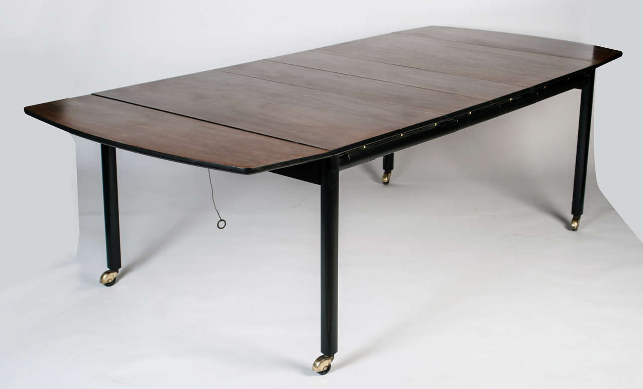 Beautiful table by the late great Michael Taylor for Baker Furniture. Comes with two leaves.