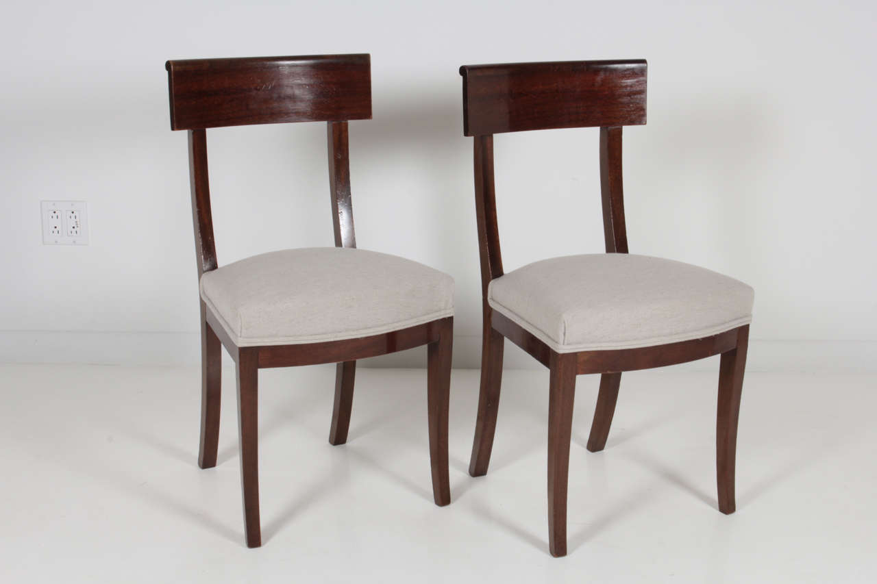 The chairs are in walnut.
The fabric is a beige linen.