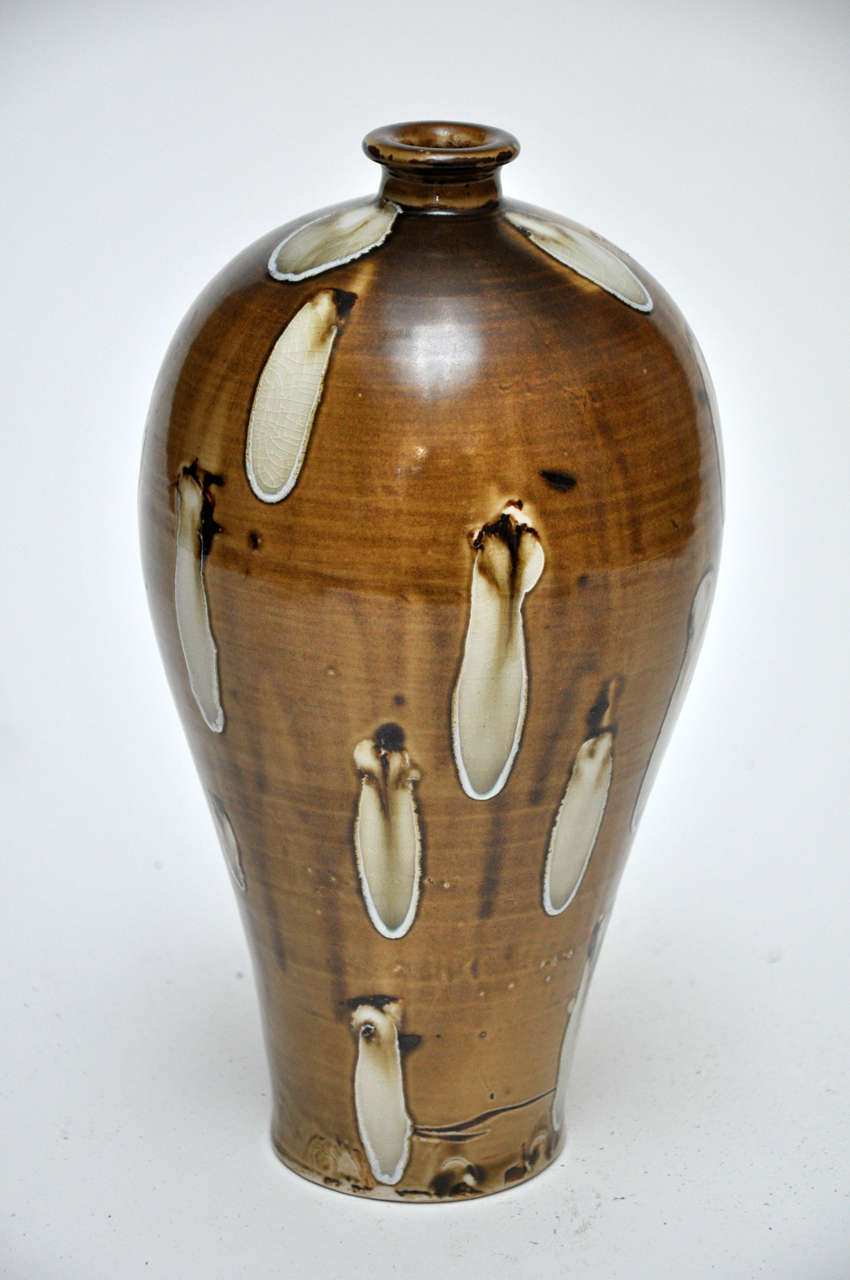 This is a Japanese sake bottle from the late Edo Period, mid 1800s.
