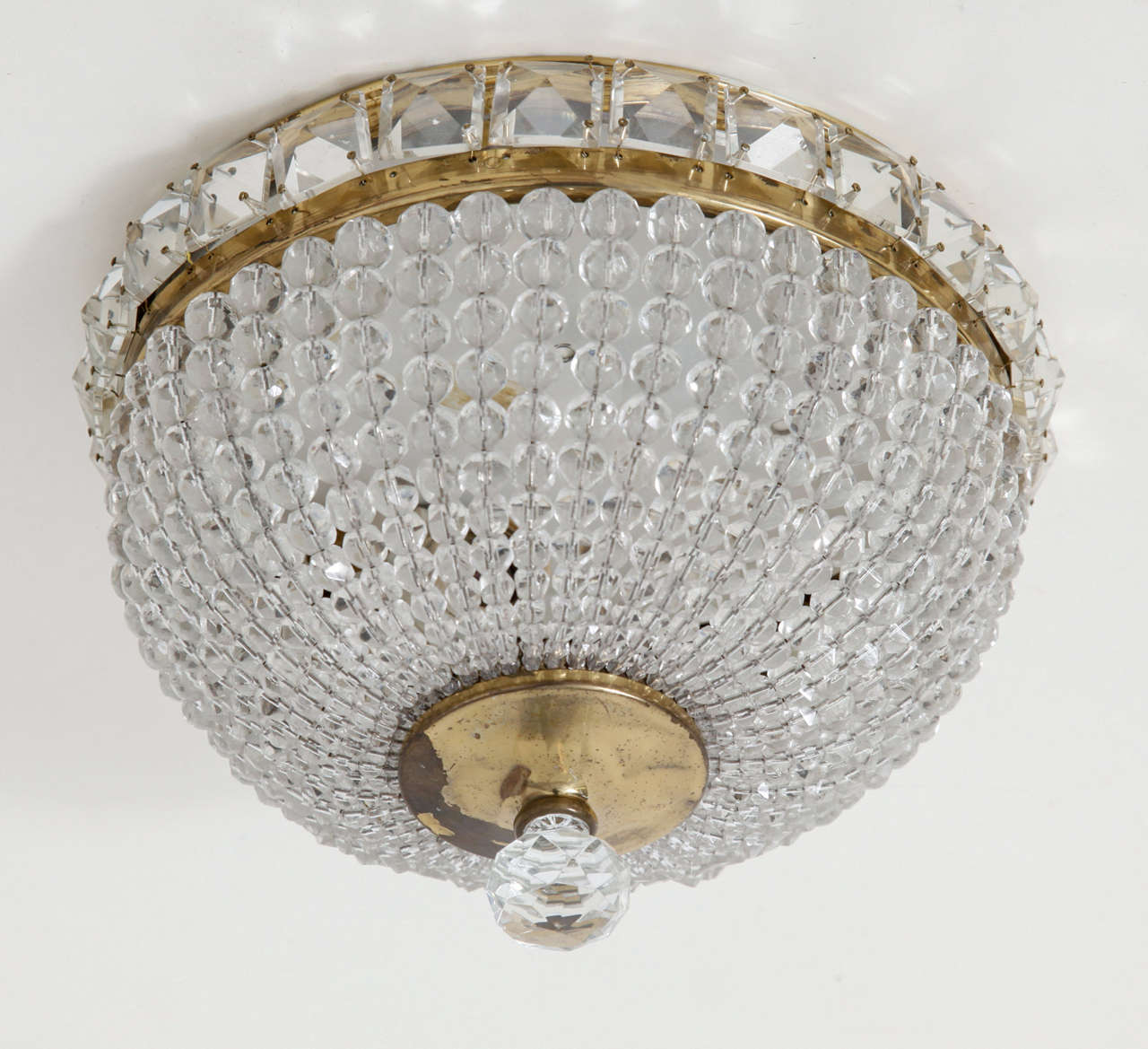 Sac a Perles or Basket Crystal and Brass Ceilinglight. Crystals hanging from a brass frame.