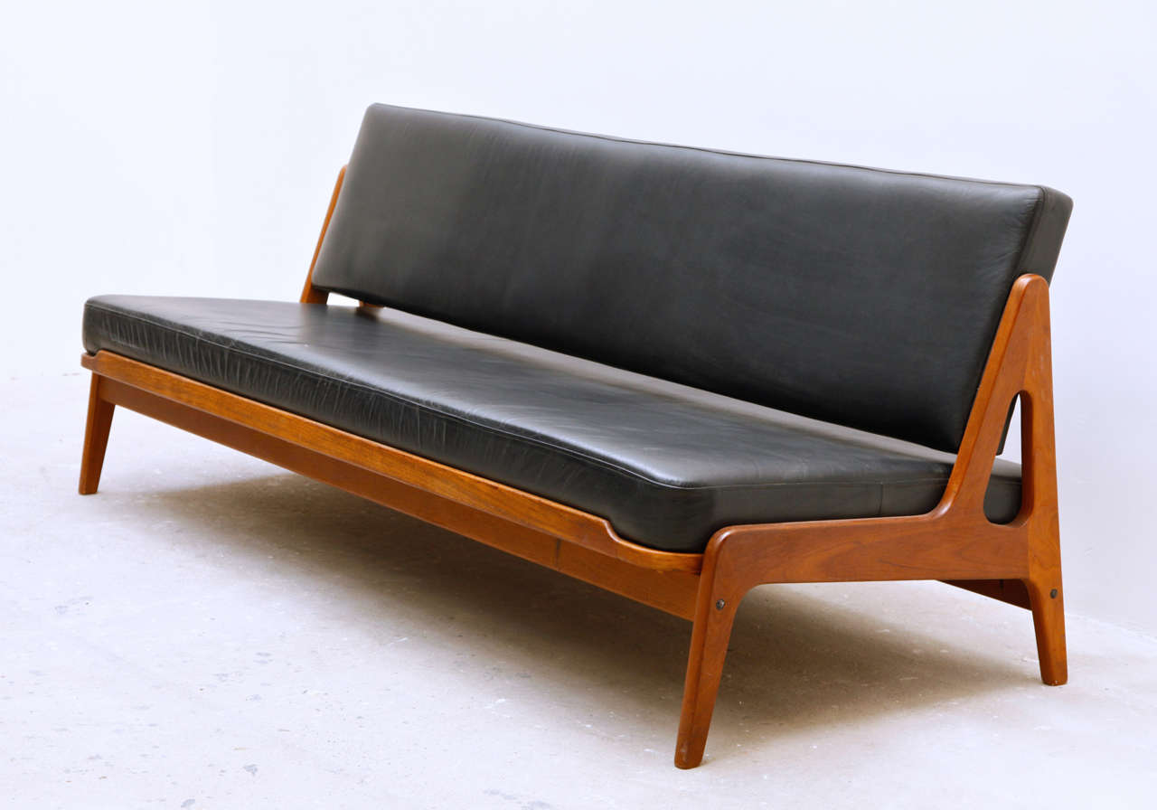 Midcentury Modern Daybed / Sofa by Arne Wahl Iversen.
Functionality is the main theme with teakwood base construction.
It can be used as a sofa or roll out for a comfortable bed.