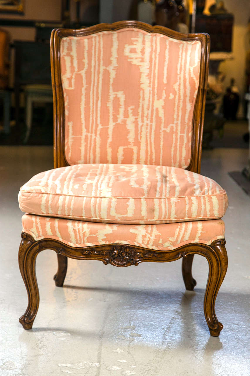 Small French Walnut Framed Slipper Chair in vintage fabric from an Estate of the late Pamela Harriman ambassador to France. Her decorator was Parish Hedley.