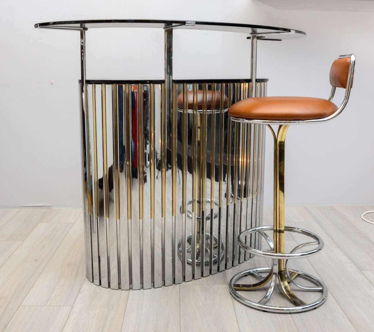 Rare high quality material dry bar. 
I shape and design makes it a great piece of furniture of the 1960s. 
Blades or visible parts visible on photos are thick.
One silver on gilded. 
Two trays black lacquer tray. 
This bar heaviness is a