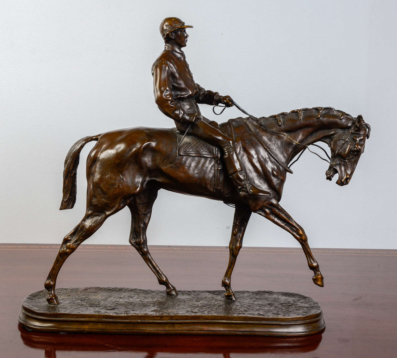Bronze sculpture by Pierre Jules Mene (1810-1879).

'Jockey on his Horse.'

Bronze with brown patina.
Signed and dated 1863. 
Not any lost wax mark.
Dimension: 41 cm x 41 cm x 14 cm.