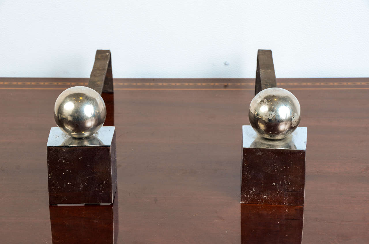 Pair of chrome steel andirons by Jacques Adnet.