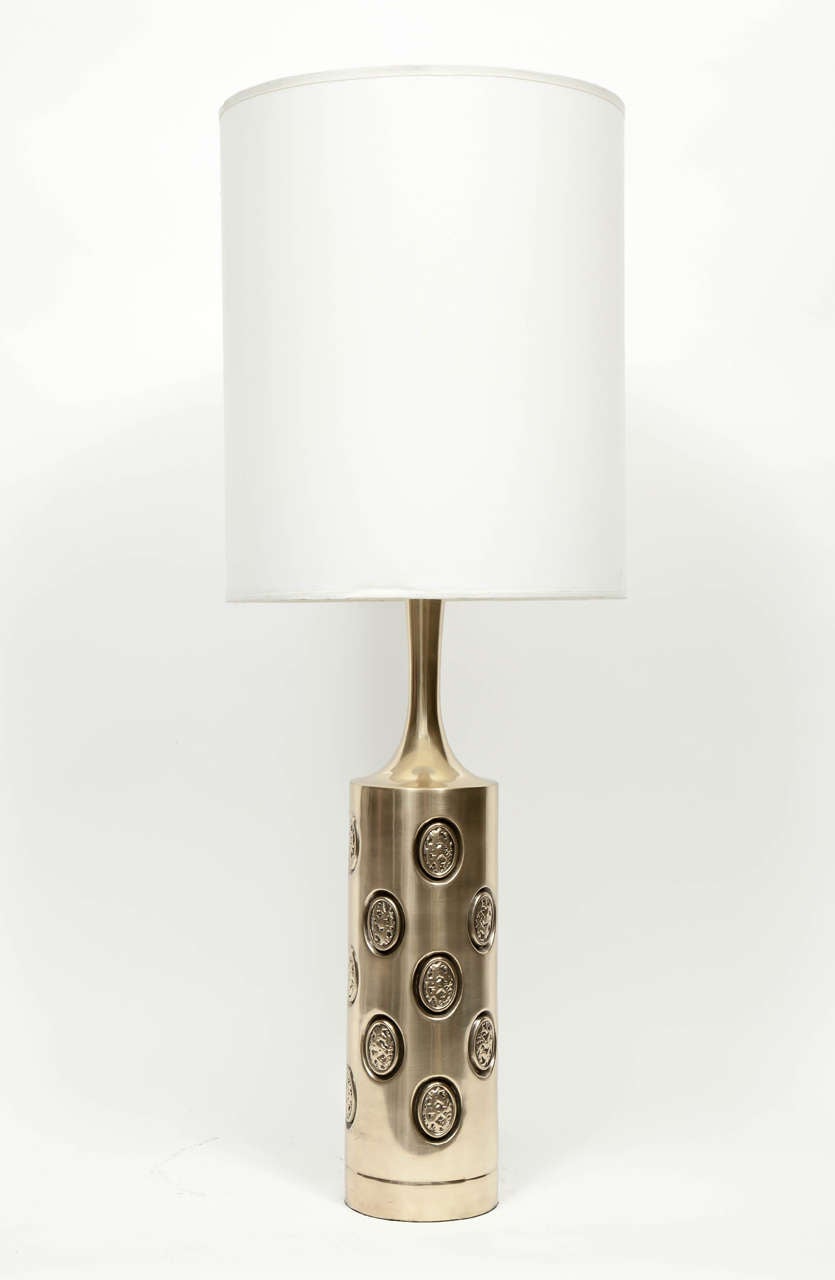 Midcentury brutal style satin brass column lamps with embossed oval details. Rewired for use in the USA.