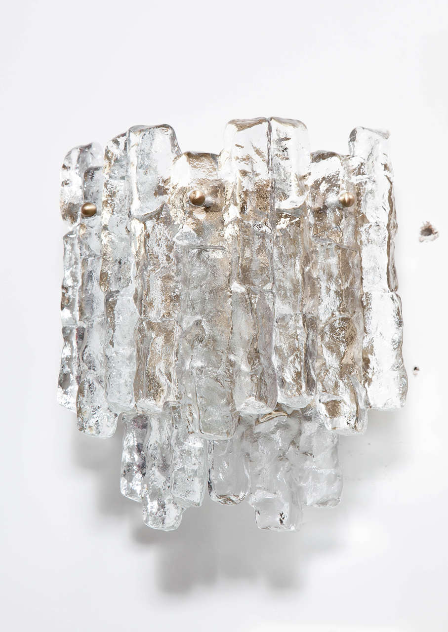 Scandinavian Modern pair of two-tier sconces composed of five ice glass elements. Each sconce has two-light sources. JT Kalmar.