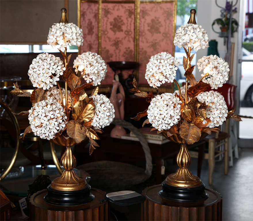 Pair of gilded metal lamps, each one consisting of six hydrangeas lit from within.