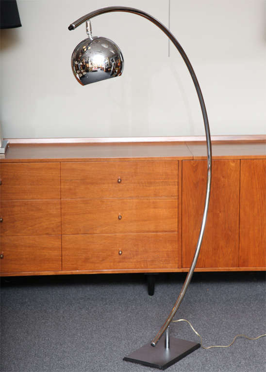 SOLD JAN 2012 With its articulating chrome ball shade, this Arc lamp is quite versatile and human scale.  Complimenting all modern period decors from Art Deco to contemporary, it has an architectural and sculptural presence.  Perfect chair side, for