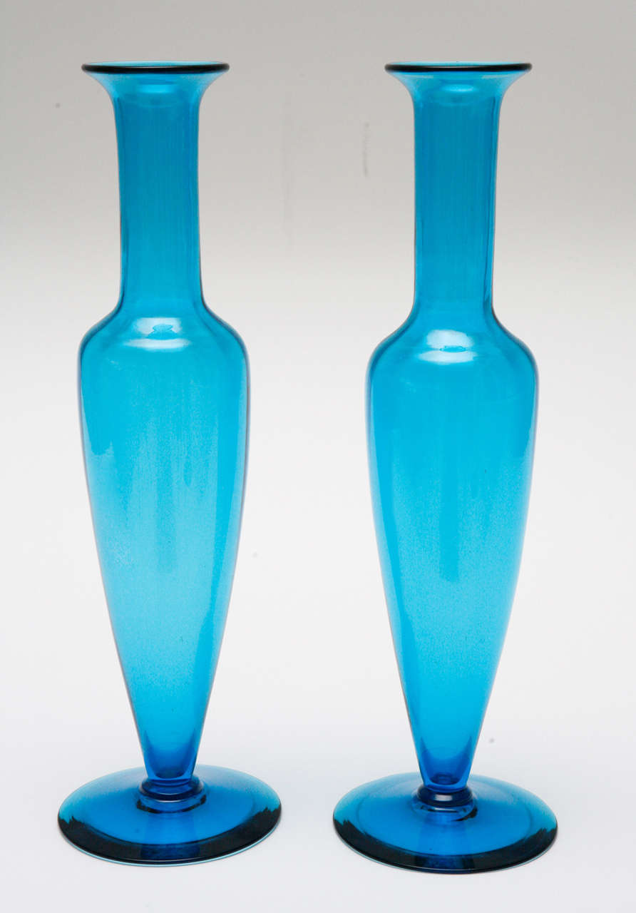 A beautiful pair of tall, slender Murano glass vases in turquoise blue. Attributed to Venini.