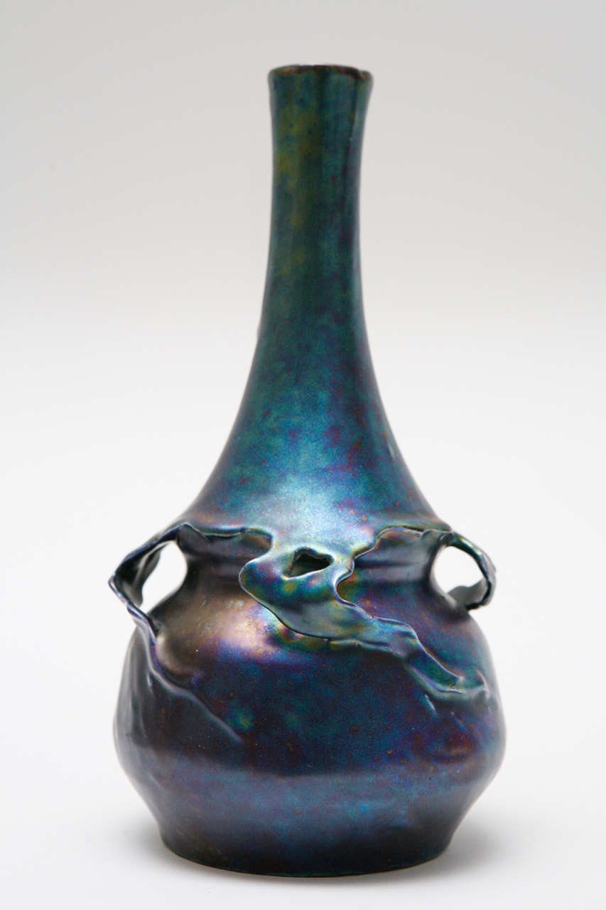A lovely turn-of-the-century Austrian Art Nouveau vase with an iridescent glaze and naturalistic form.  Vase is unsigned, but have several numbers incised to the bottom.