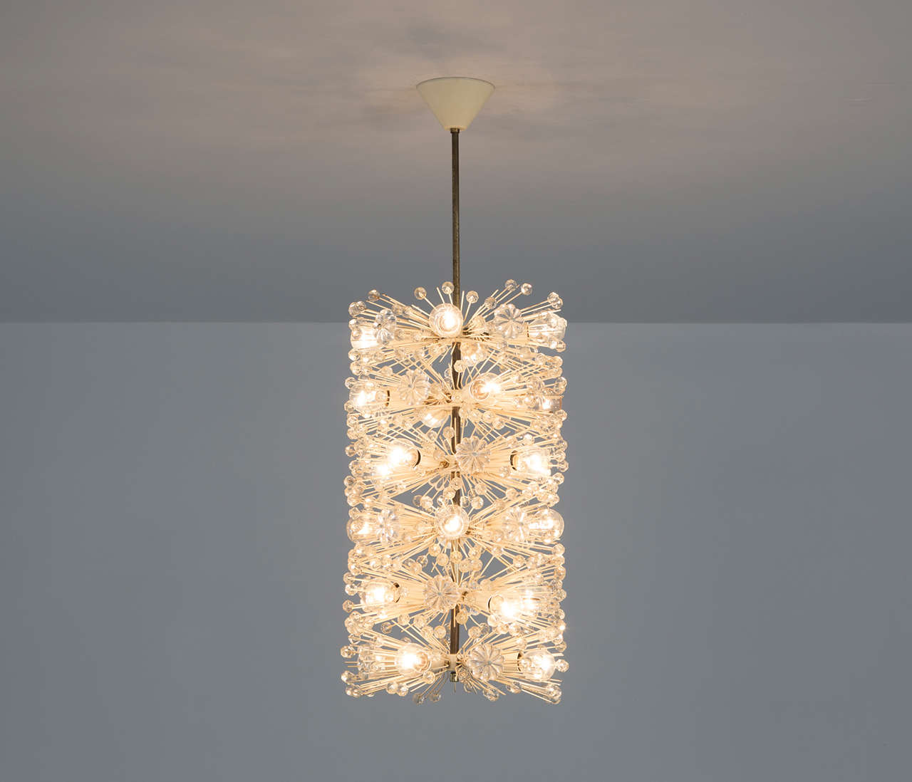 Very rare cylindrical shaped chandelier by Emil Stjenar and made by Rupert E. Nikoll, Austria, 1960s.

The flower shaped glass decorations are an icon for the designs of Stejnar. 

The brass stem is nicely decorated with white lacquered steel