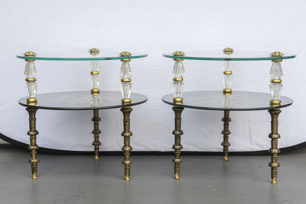 Elegant and unique, these pretties Goran Belgium glass end tables will add a touch of glamorous Hollywood Regency style to any room. Produced by Goran and made in Belgium, that brass, glass and crystal end tables are in beautiful condition. Each