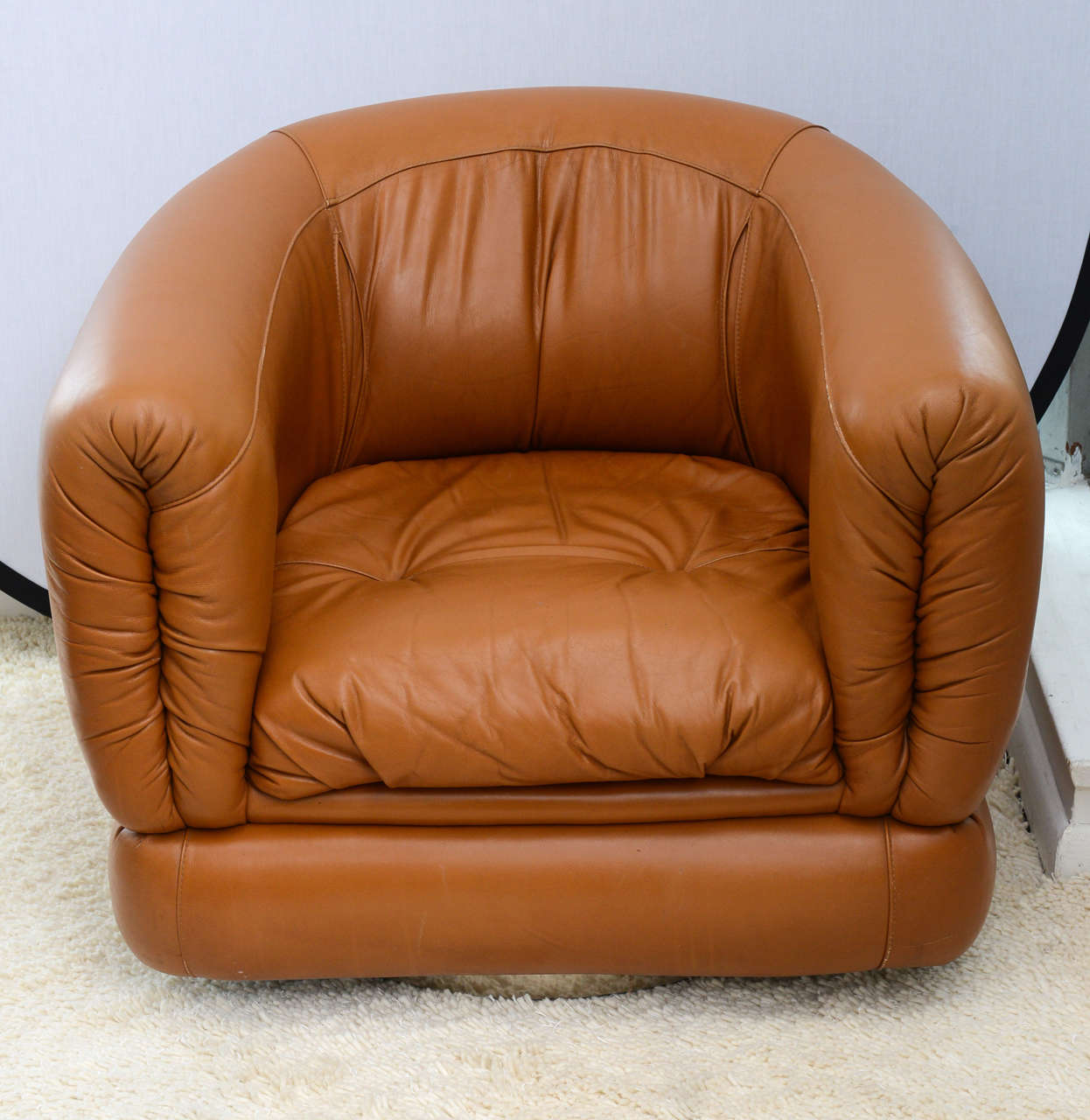 Those gorgeous leather chairs are very comfortable. They are swiveling at 360 degrees on a metal base. The leather are in good condition.