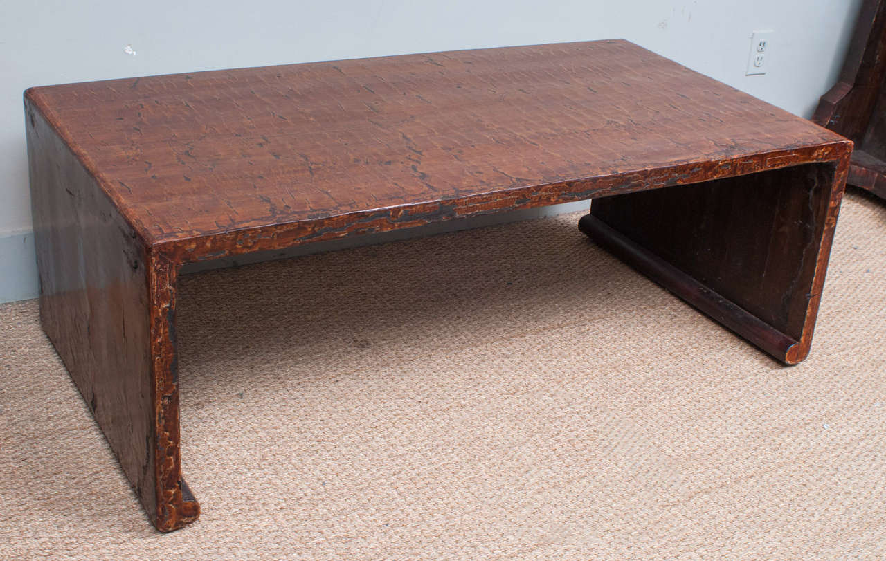 This rare Chinese scroll table is of Minimalist form with a stunning brown or black, crazed, original lacquer finish which has been expertly conserved.