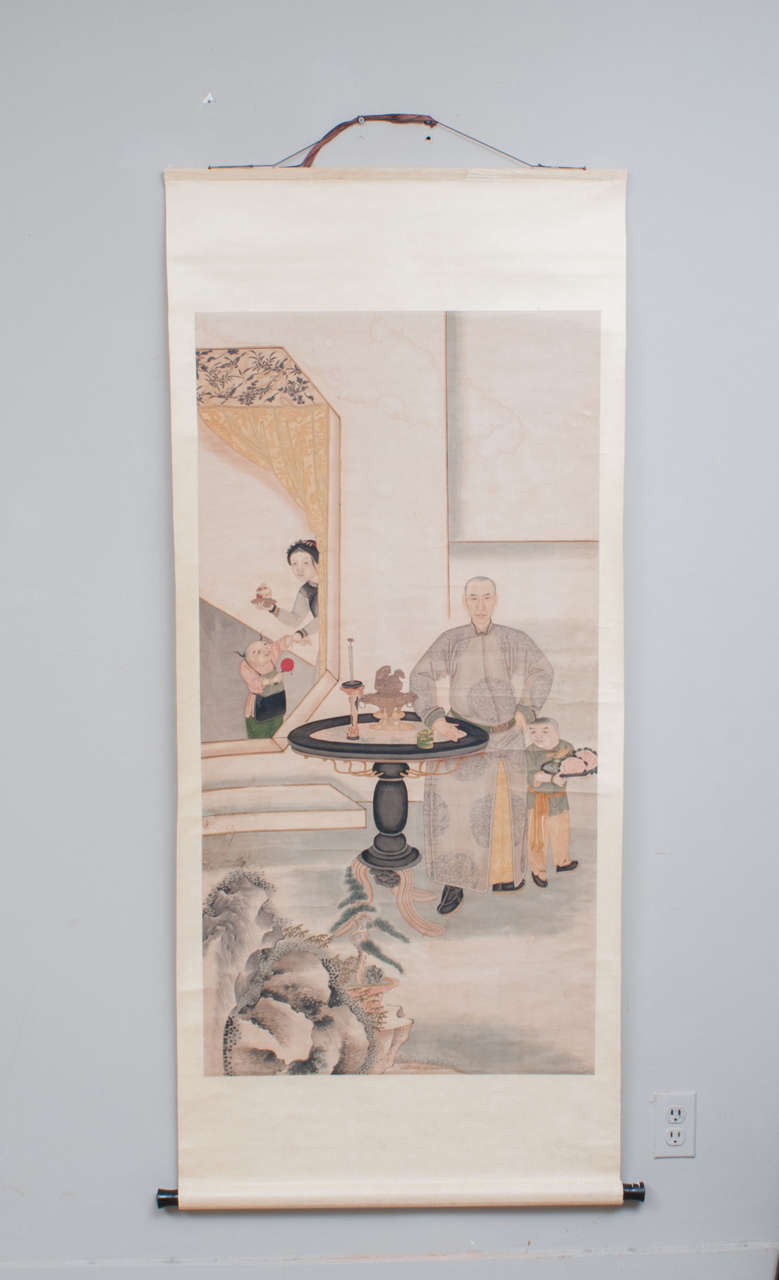 Qing dynasty scroll with unusual subtle coloration depicting master of the household attended by servants. The three virtues of rock, bamboo and pine are incorporated in this symbolic portrait.