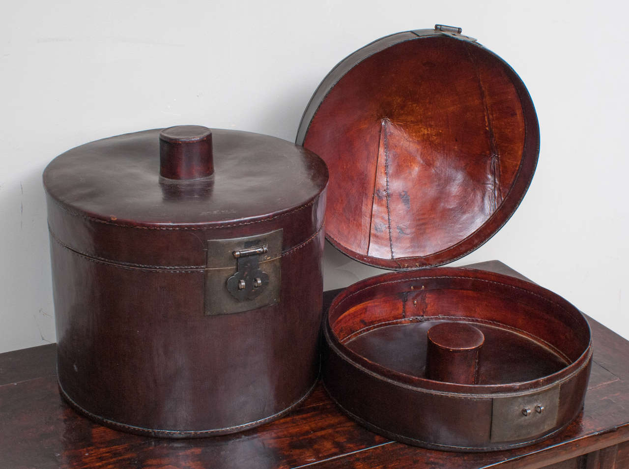 Black leather Chinese hatbox with original hardware and impeccable condition.