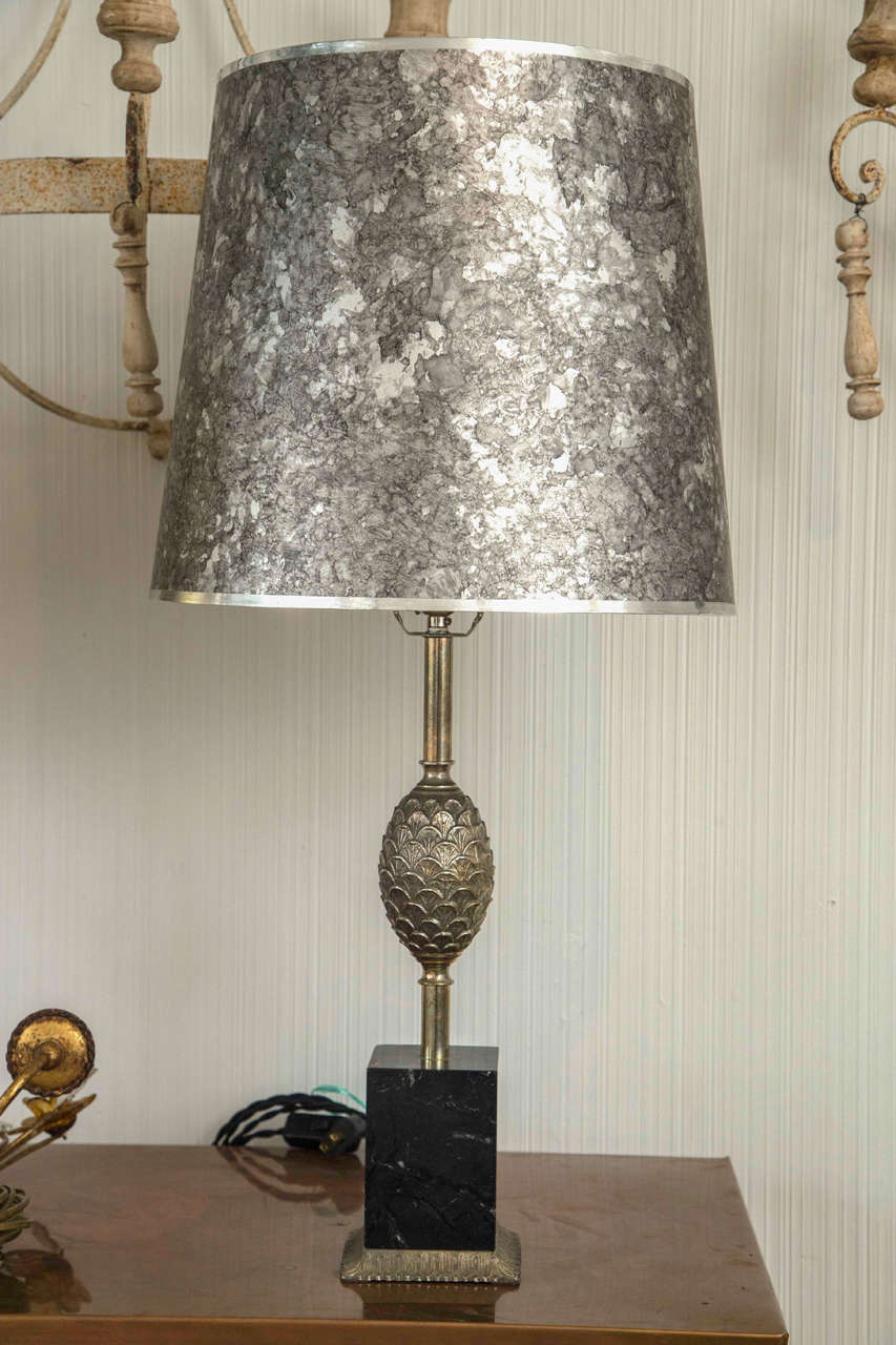 Pair of silver tone and black marble lamps attributed to Maison Charles.