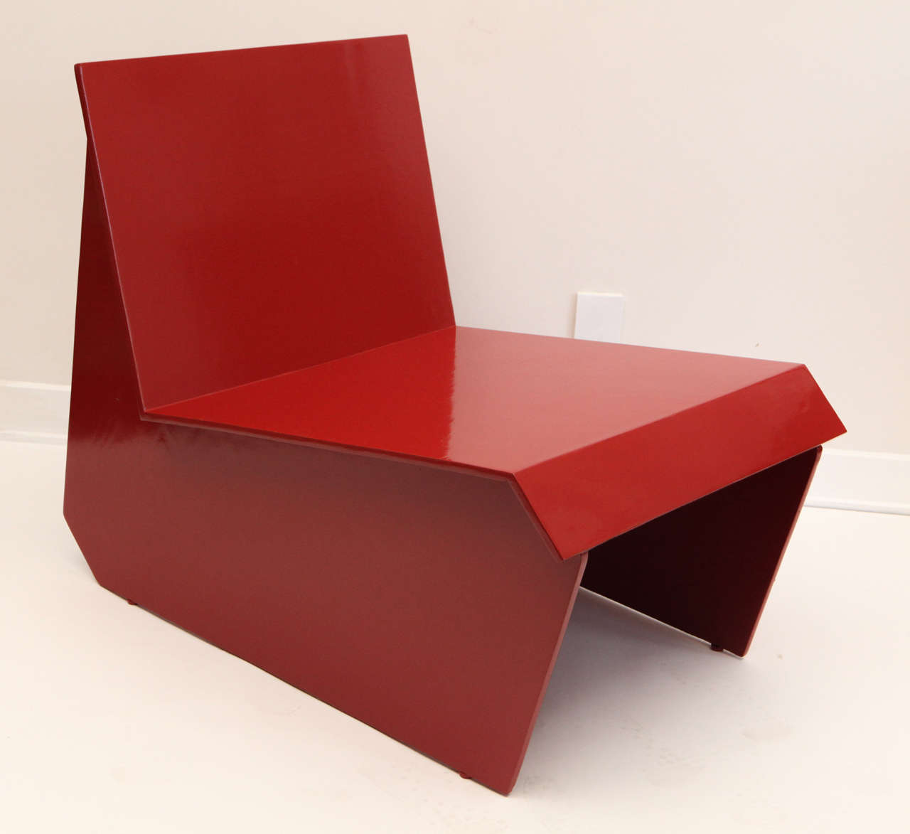 Vintage architectural lounge chair, after Frank Lloyd Wright, recalling his designs for the Auldbrass Plantation in South Carolina, c. 1939.  Recently restored in the original deep red lacquered finish.