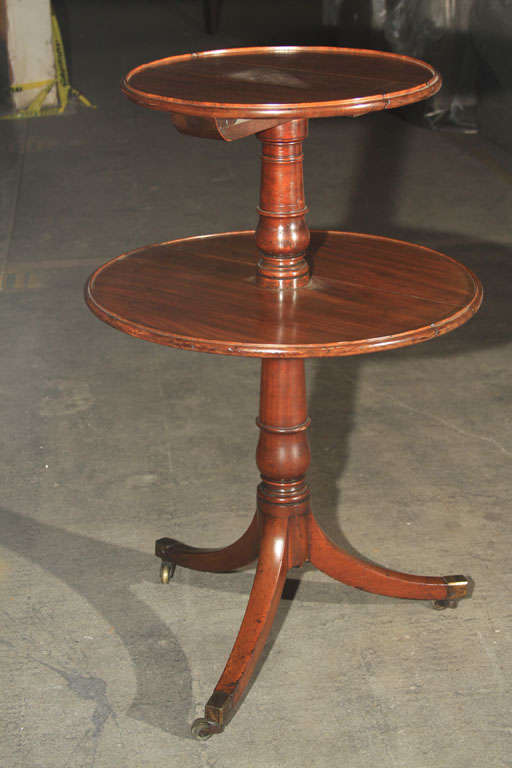 19th century late Georgian 2 tier butler stand with casters. Each round table folds down.