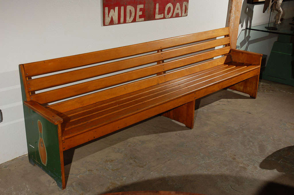 This is a fun and practical piece of  Americana. The side panels of the bench are relief carved and painted green and blue & red with 'Blue Ribbon' American Bowling Congress Ten Pin Regulation stickers. <br />
<br />
The American Bowling Congress