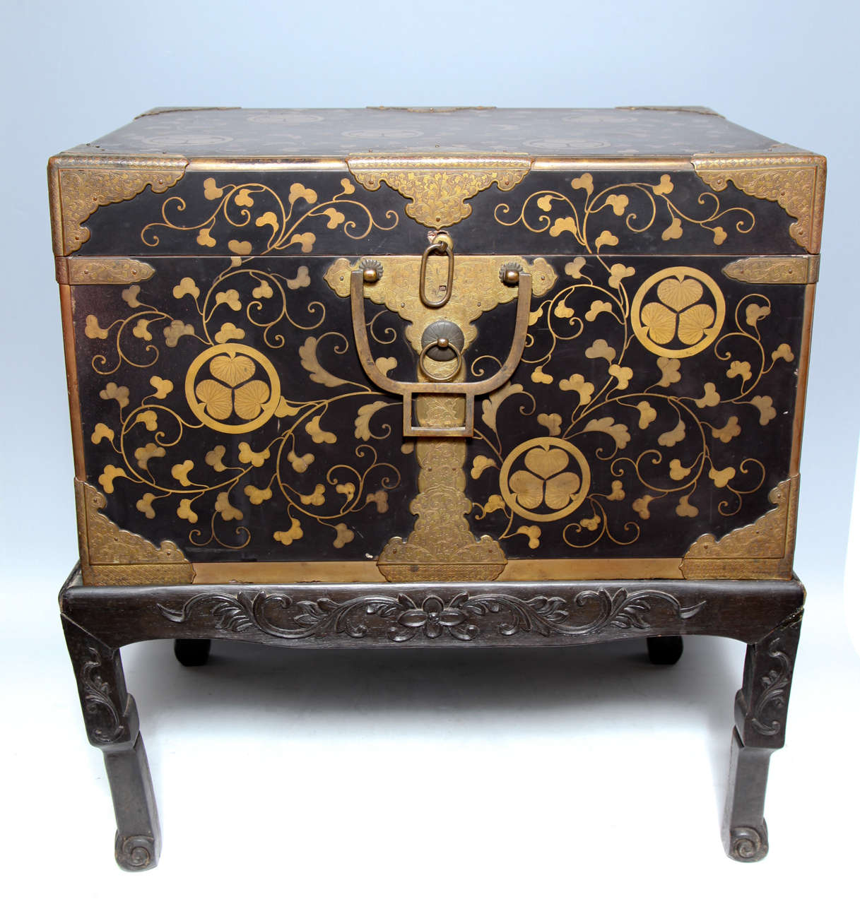 A fine pair of Japanese lacquer traveling trunks, on English Style bases, the upper portion opens revealing a lacquer tray and further storage below, in perfect condition. The exterior bears the three- leaf (crest) of the ancient Tokagawa family. 