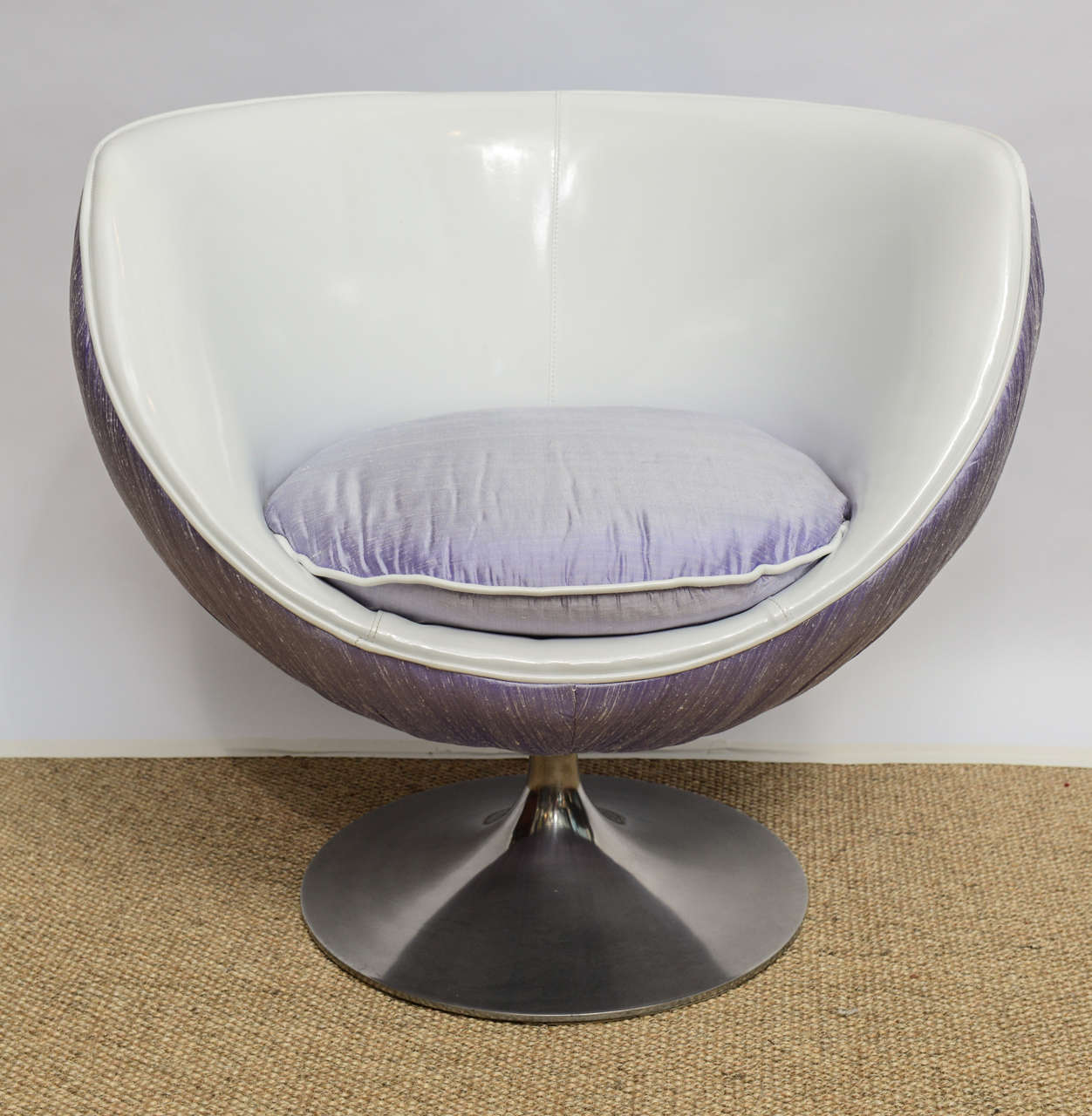 A charming accent of Mid-century modern space age swivel lounge chair comfortable and newly reupholstered in purple silk and gloss white vinyl.The base is on stainless steel