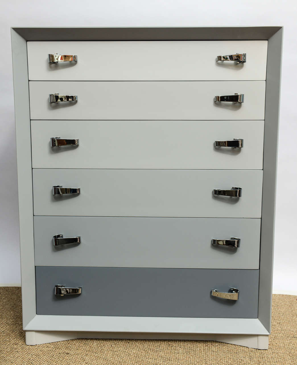 Beautiful Six drawers, 1940's machine age Chester of Drawers with original brass handle who have been chromed; the piece has been beautifully refinished by our Furniture Restoration Division on different tones of Grey. The Six deep drawers are