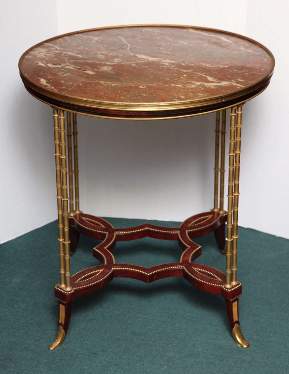 A very fine round marble top Louis XVI style gueridon with bronze bamboo legs
Stock Number: F96.