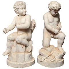 Pair of marble figural cherubs