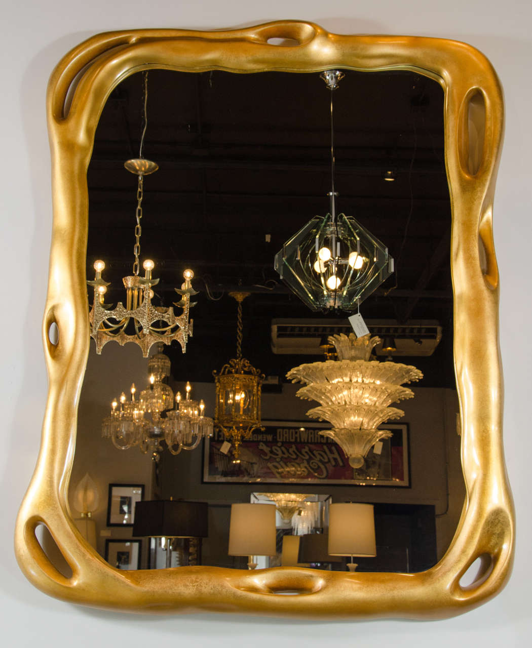 Considered one of Duquette's most inspired works, this was originally designed for the Charles and Palmer Ducommun Bel Air residence in the 1960s.
Impeccably recreated by Baker, the mirror is cast in resin, then fabricated to produce its undulating