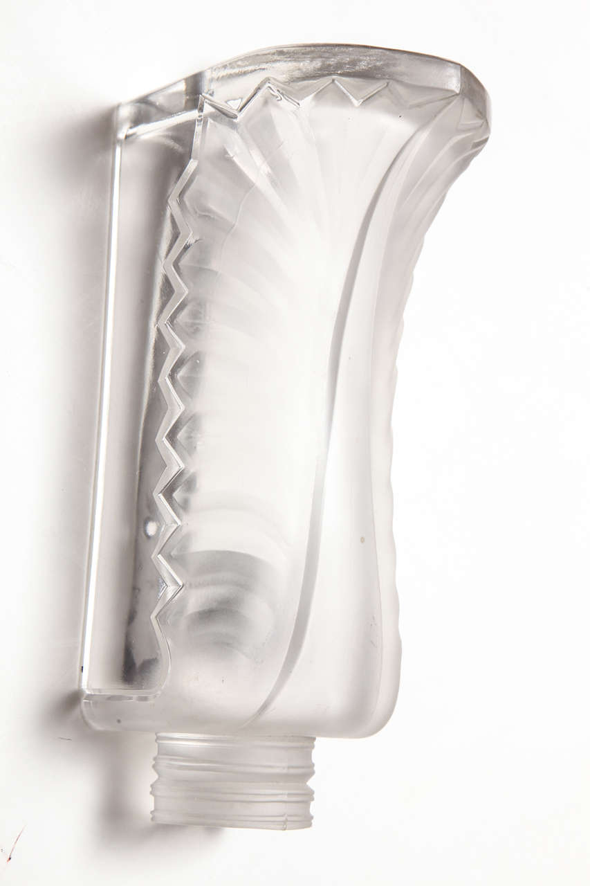Pair of Lalique Palme wall sconces, designed post 1945, molded crystal glass. Measures: H 10.35