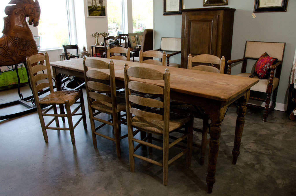 Farmhouse table with reinforced legs structure of wrought metal.or country with six straw-bottomed chairs(35