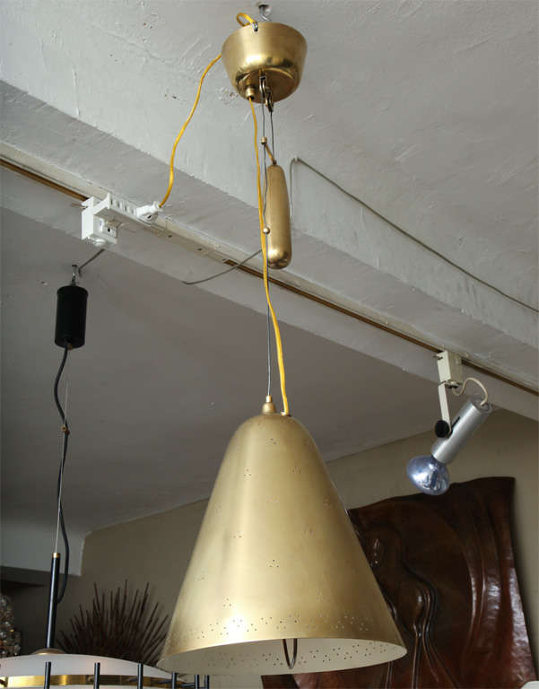 A Modernist Counter Balance brass adjustable Ceiling Light by Paavo Tynell