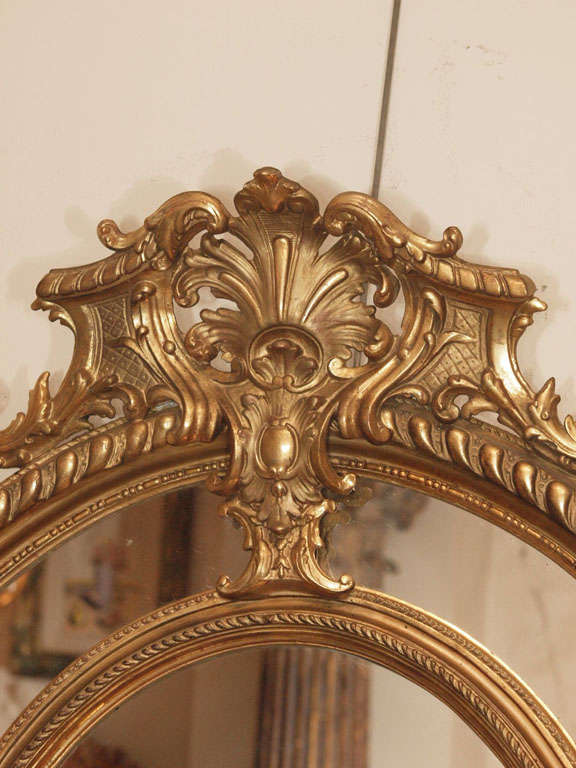 French A Fine Pair of Antique Oval Carved Giltwood and Gesso Mirrors For Sale