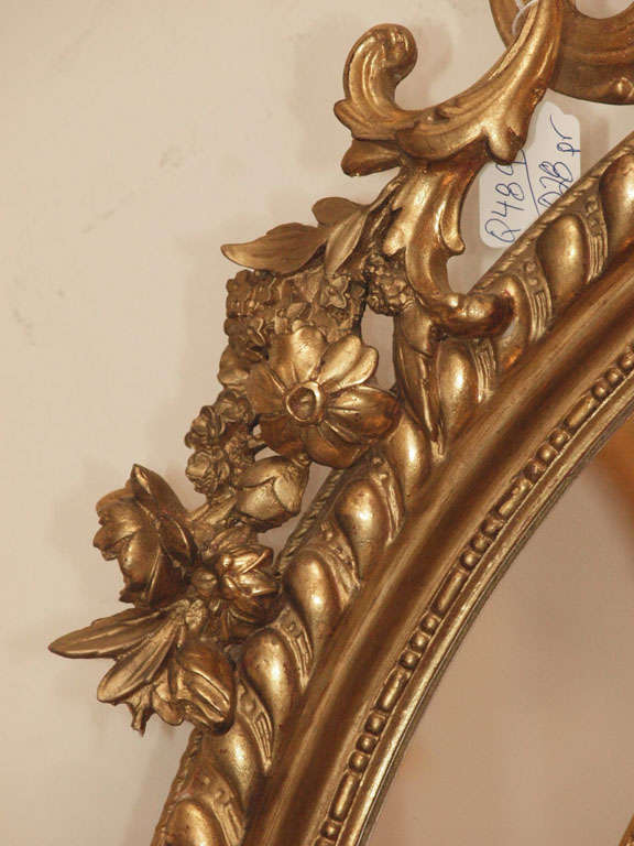 A Fine Pair of Antique Oval Carved Giltwood and Gesso Mirrors For Sale 1